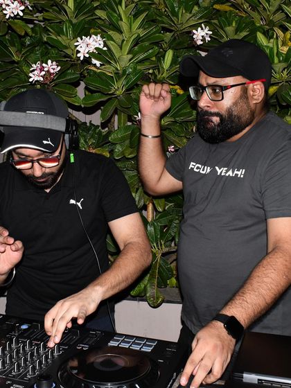 Here we are, Mann'e X Rhythm, working the decks together at a private party. Our two-person setup allows for complex mixes and continuous engagement with the audience.