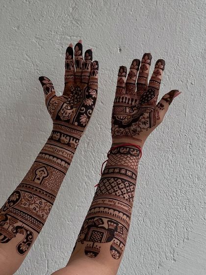 Another view of the personalized design, showing how different elements like jharokhas and lotuses are woven together to create a unique story.