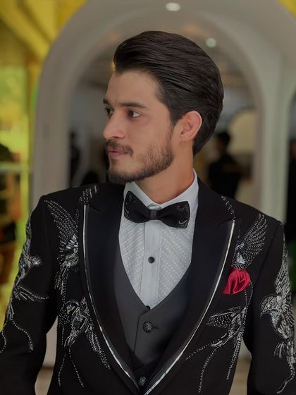 The perfect haircut complements a sharp suit. This client looks confident and ready for his event.