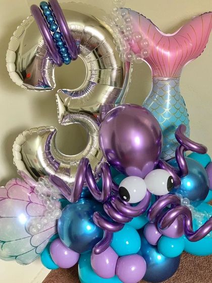 A close-up of the octopus balloon sculpture, showing the detailed craftsmanship and use of different balloon sizes and shapes.