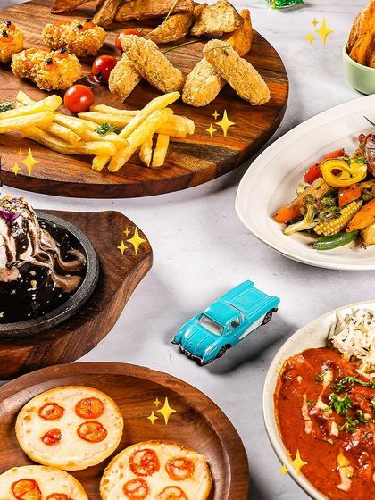 A feast fit for the little ones! This platter includes mini pizzas, chicken nuggets, fries, veggies, and a sizzling brownie. I've made sure there's something for every little foodie.