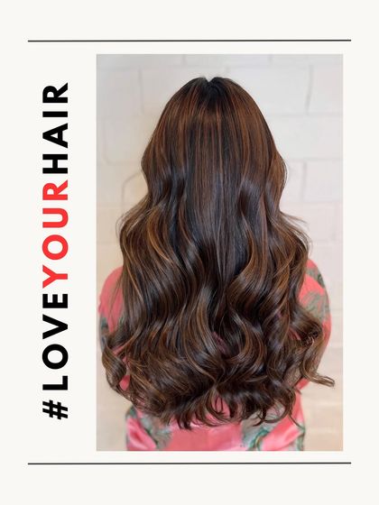 A full back view of the brunette balayage, emphasizing the length and health of the hair, as well as the seamless colour blend.