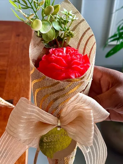 A trial for a new product, this single red carnation candle is wrapped like a small bouquet. I'm always experimenting with new ideas!