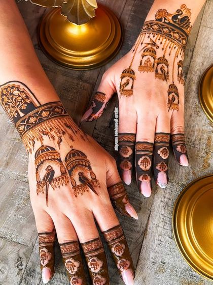 A shot of both hands with the bird cage design, showing how it creates a cohesive look.