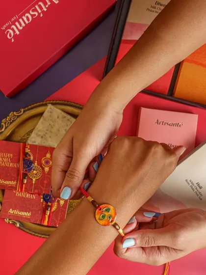 Another shot from a Rakhi campaign, this one focuses on the act of tying the rakhi. The composition draws the eye to the product while telling a story of sibling love and celebration.