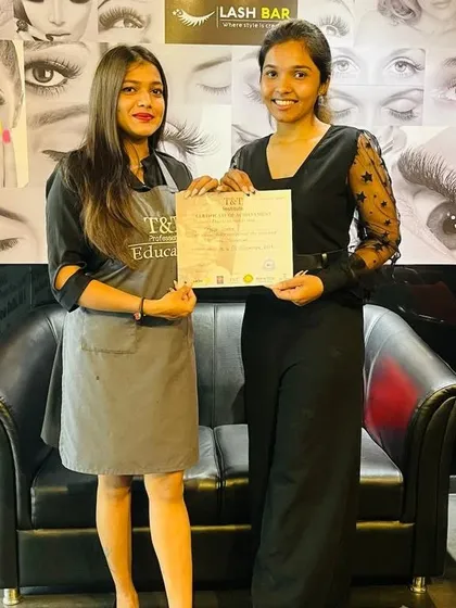 Celebrating a student's completion of the Pro Nail Tech Course. She is now a certified professional, ready to build her career.