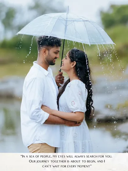 A couple gazes at each other under a clear umbrella as gentle rain falls around them. This is a perfect example of a cinematic, romantic shot that tells a story.