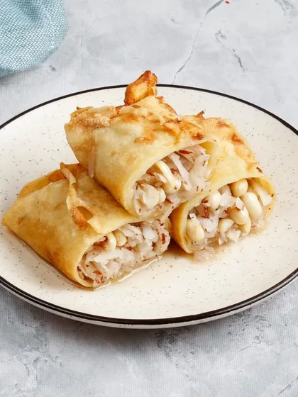 A closer look at our sweet coconut-filled rolls, a perfect dessert to balance out a spicy meal.