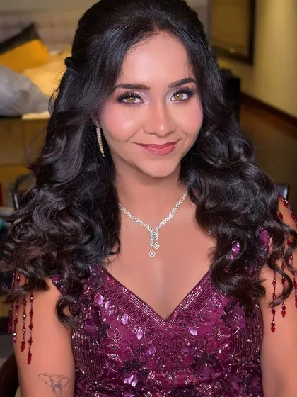 Another angle of this beautiful reception look, showing how the soft curls frame her face perfectly.