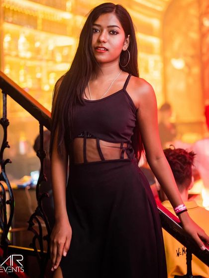 A guest posing on the stairs.