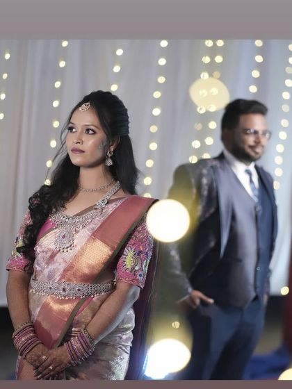 A creative shot with bokeh lights, highlighting the bride's elegant look.