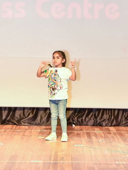 Anaira strikes a confident pose, showcasing the powerful stage presence she has developed.