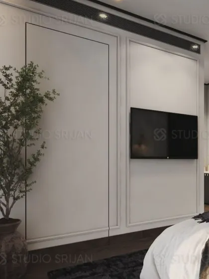 The TV wall is kept simple with classic wall molding, allowing the other design elements in the room to stand out.