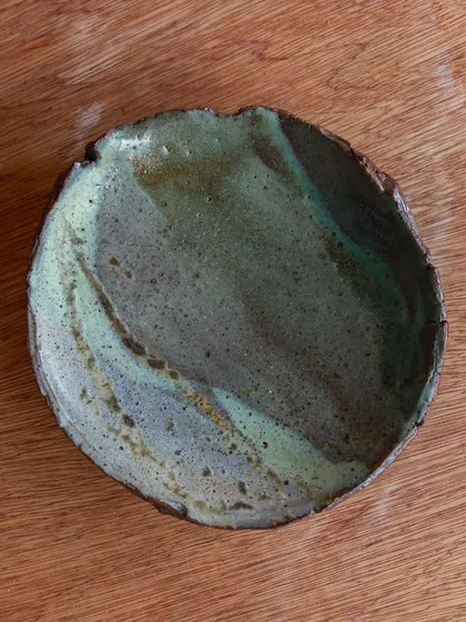 This platter is from a workshop where I learned to create unique textures using found objects and foraged materials. I love how the glazes pooled in the impressions, creating a beautiful, varied surface.