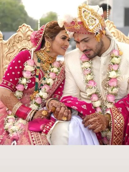 A stunning bridal couple. We offer complete bridal makeup packages to make sure you look perfect on your special day.