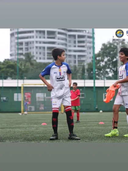 A candid moment between two U12 players during a weekly session at our Cooperage Ground center.