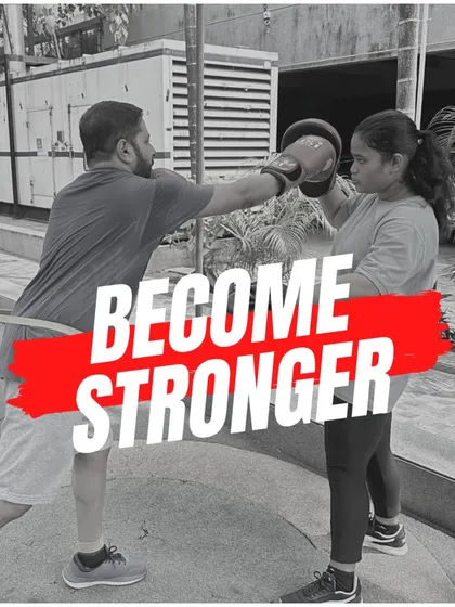 Become stronger with every session. A student works on his punching power and technique with a resistance band, an excellent tool for building strength.