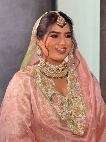 My beautiful bride Nam for her Lava wedding. This look is a perfect example of a modern Punjabi bridal style, with a soft glam touch that complements her pastel outfit and traditional jewelry.
