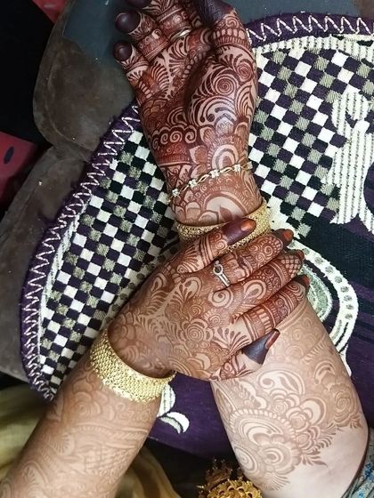 This client's mature stain is absolutely gorgeous. The deep color on the palms contrasts beautifully with the lighter stain on the arms, a natural effect of henna.