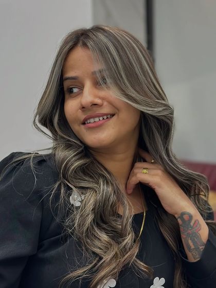 The joy and confidence that come with a new hair color are evident in this shot.