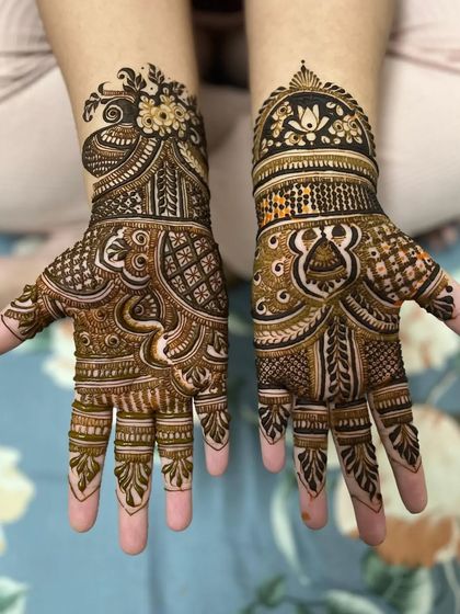 A bold and beautiful design for a wedding guest. The patterns are dense and intricate, covering the entire palm with a mix of traditional Indian motifs.