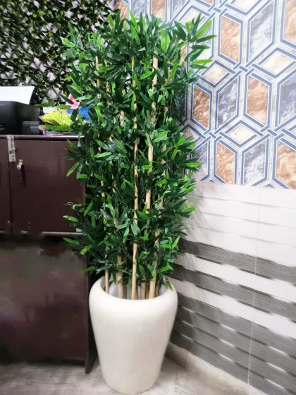Artificial plants like this tall bamboo in a ceramic planter are a great way to add greenery to a corner with zero maintenance.