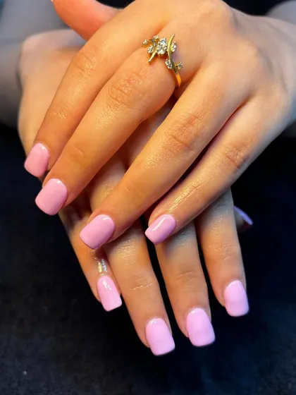 Another look at the lovely solid lavender gel manicure, showing off the neat cuticle work and glossy finish.