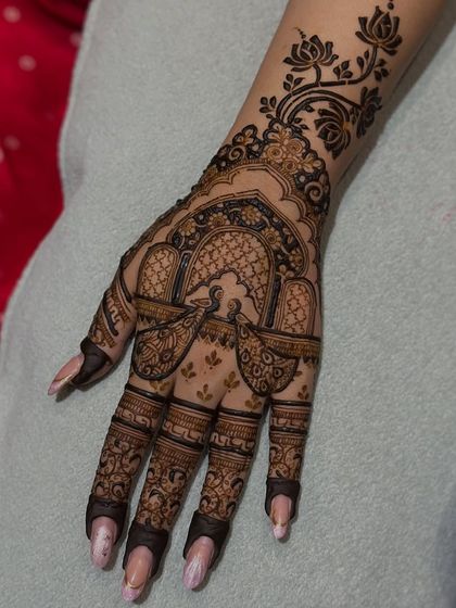 A close-up of the peacock and jharokha design, showing the fine lines and details.