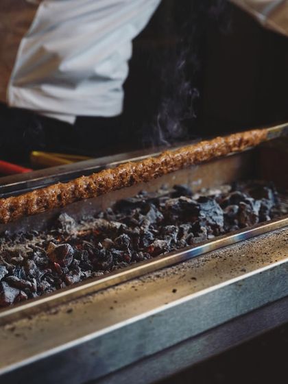 A Turkish-focused experience awaits you. Our extensive menu features traditional mezzes, perfectly grilled kebabs, and authentic Turkish pizzas, all cooked over charcoal for that smoky flavor.