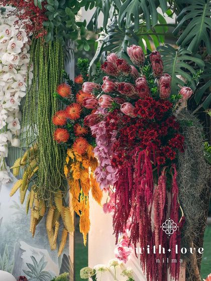 A close-up of the rich textures and colors of the 'Garden of Gaia' floral wall.