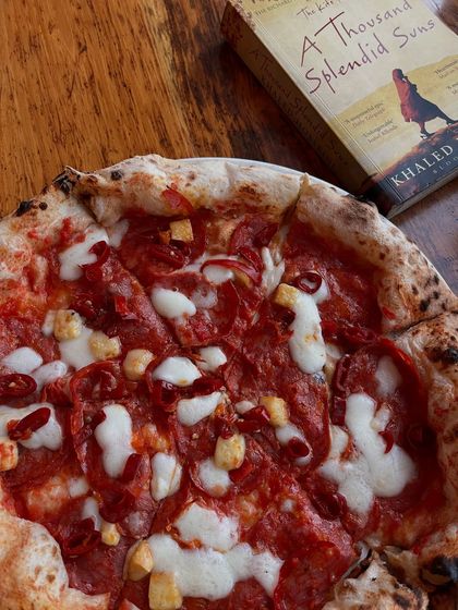 A good book and a great pizza. This is our spicy pepperoni pizza, perfect for a quiet afternoon.