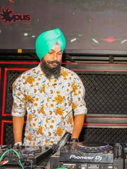 At the Pioneer DJ console at Opus Club. I have experience playing on industry-standard equipment at top clubs.