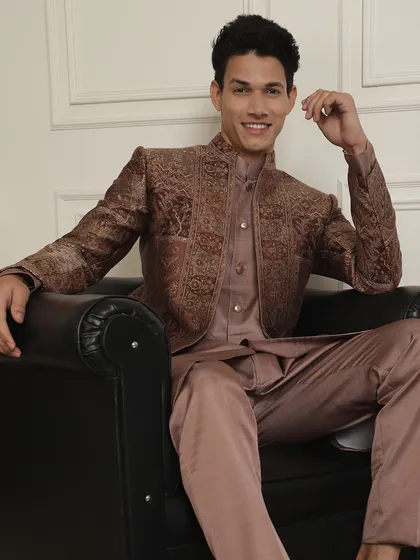 There is something magical about summer romance and weddings. This brown patterned Indo-Western jacket is cool enough for any occasion, from a Sagai to a Sangeet.