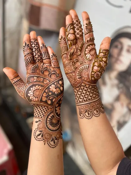 A slightly different angle of the same classic full-hand design, showing the details on the thumbs and wrists.