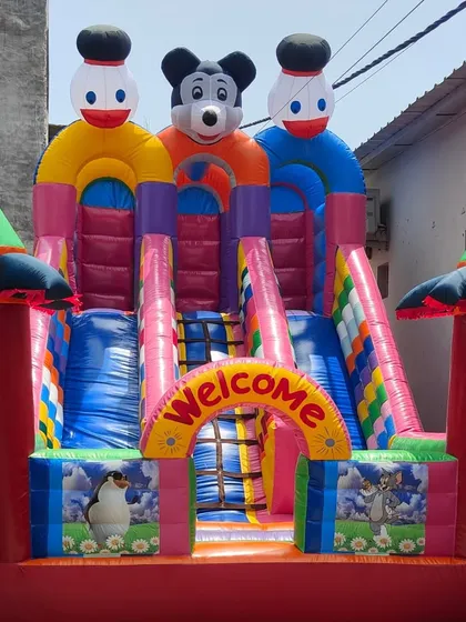 A look at our classic 12x18 foot 3-slider bouncy, one of our most requested models. This Mickey and Donald theme is always popular, and the triple slide design keeps the fun moving at any event.