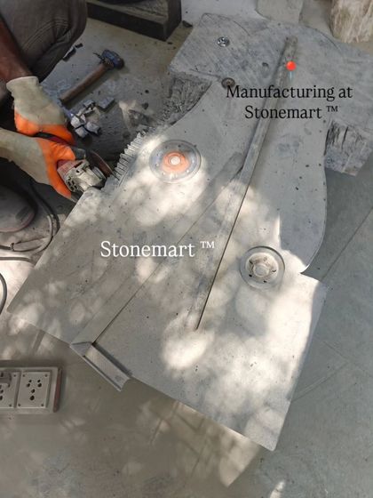 A close-up of the precise cuts being made on a granite block for a modern Ganesha sculpture. This highlights the skill required to shape these large stone pieces.