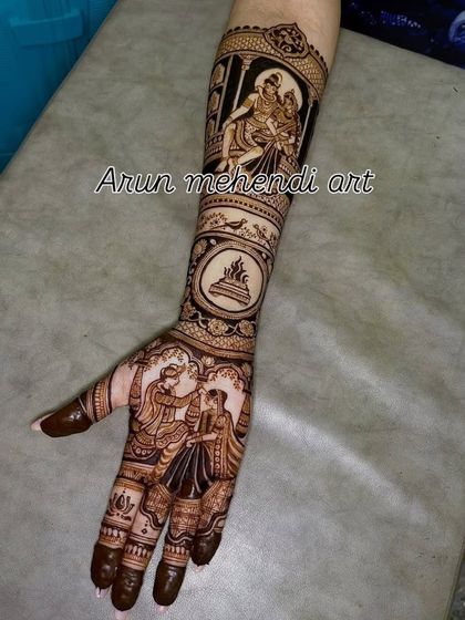 A single arm design featuring a varmala scene on the palm and a depiction of Shiv and Parvati on the forearm.