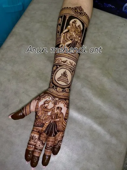 A single arm design featuring a varmala scene on the palm and a depiction of Shiv and Parvati on the forearm.