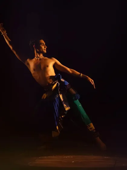 A pose of extension and grace, reaching outwards. This demonstrates the use of space and the expansive quality of Kuchipudi movements.