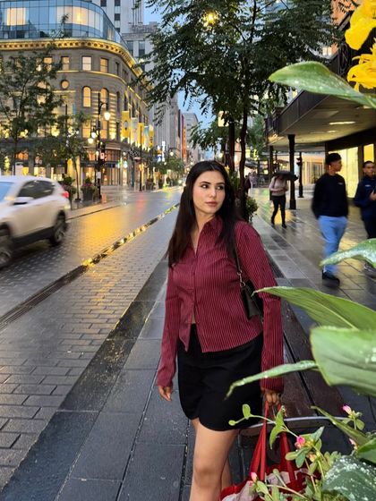 A candid shot on a rainy evening in downtown Montréal. The wet streets and city lights create a moody, cinematic atmosphere.