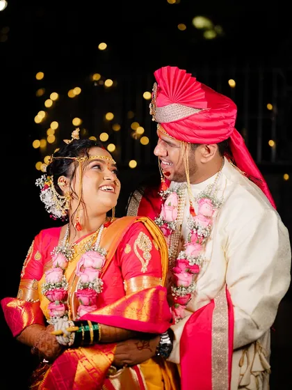 A joyful, laughing portrait of the couple, capturing the pure happiness of their wedding day.