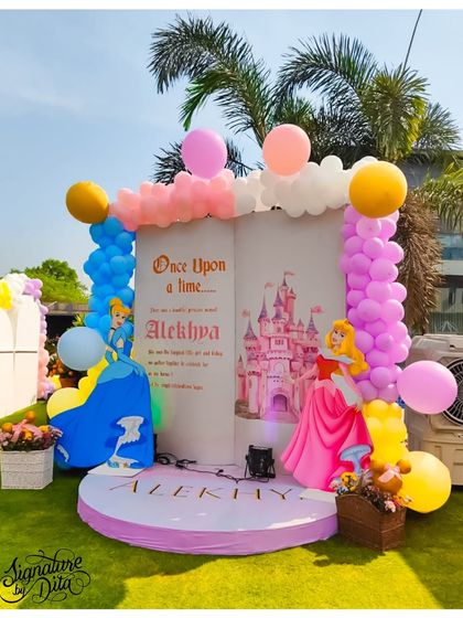 The 'Once Upon a Time' storybook entrance for a Disney Princess party. Featuring Cinderella and Sleeping Beauty, this large prop creates a magical entryway and a perfect photo opportunity for the little princess.