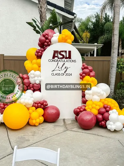 A graduation party setup for "Lily, Class of 2024," using school colors in the balloon arrangement for a personalized touch.