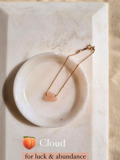 The Peach Moonstone cloud bracelet, a charm for luck and abundance.