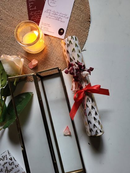 The glass box keeps the delicate scroll safe, turning a simple letter into a beautiful decorative piece.