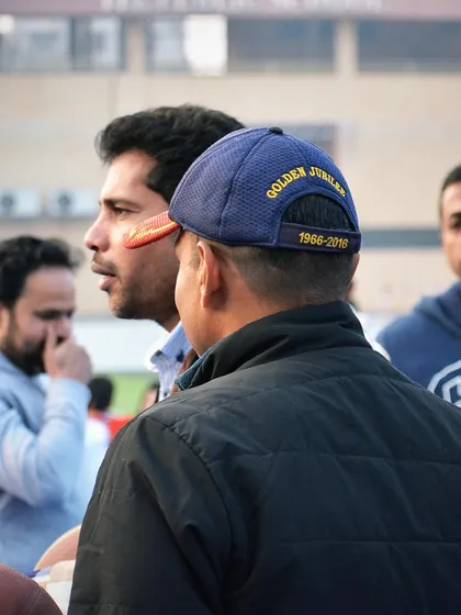 A candid moment of coaching and encouragement during the parents' match. These events strengthen our community bonds.