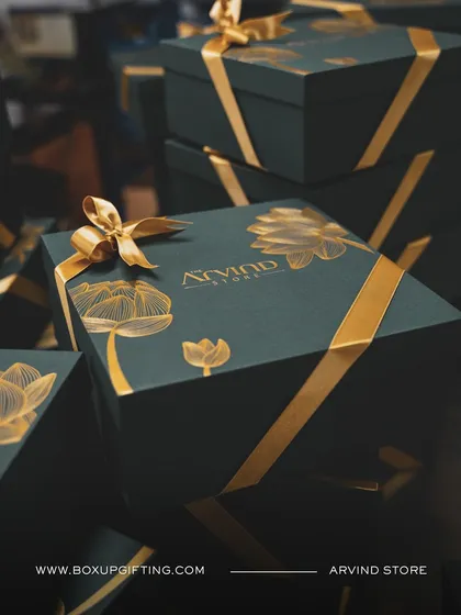 A closer look at a custom hamper I designed for Arvind Store. The elegant dark green box with gold foil detailing and a satin ribbon reflects the brand's luxury aesthetic. Presentation is key, and I fuss over every detail.