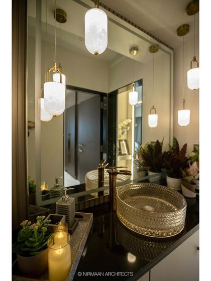 A close-up of the crystal-cut basin and gold tap. We believe that using beautiful, high-quality fixtures can transform a simple wash area into a statement of luxury.