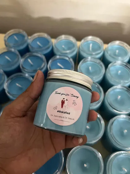 Custom candles for a Roka return favor. We can create personalized stickers with your hashtag, names, and date.