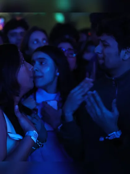 A candid moment of friendship and fun in the crowd. Our concerts are a place to connect and share unforgettable experiences.